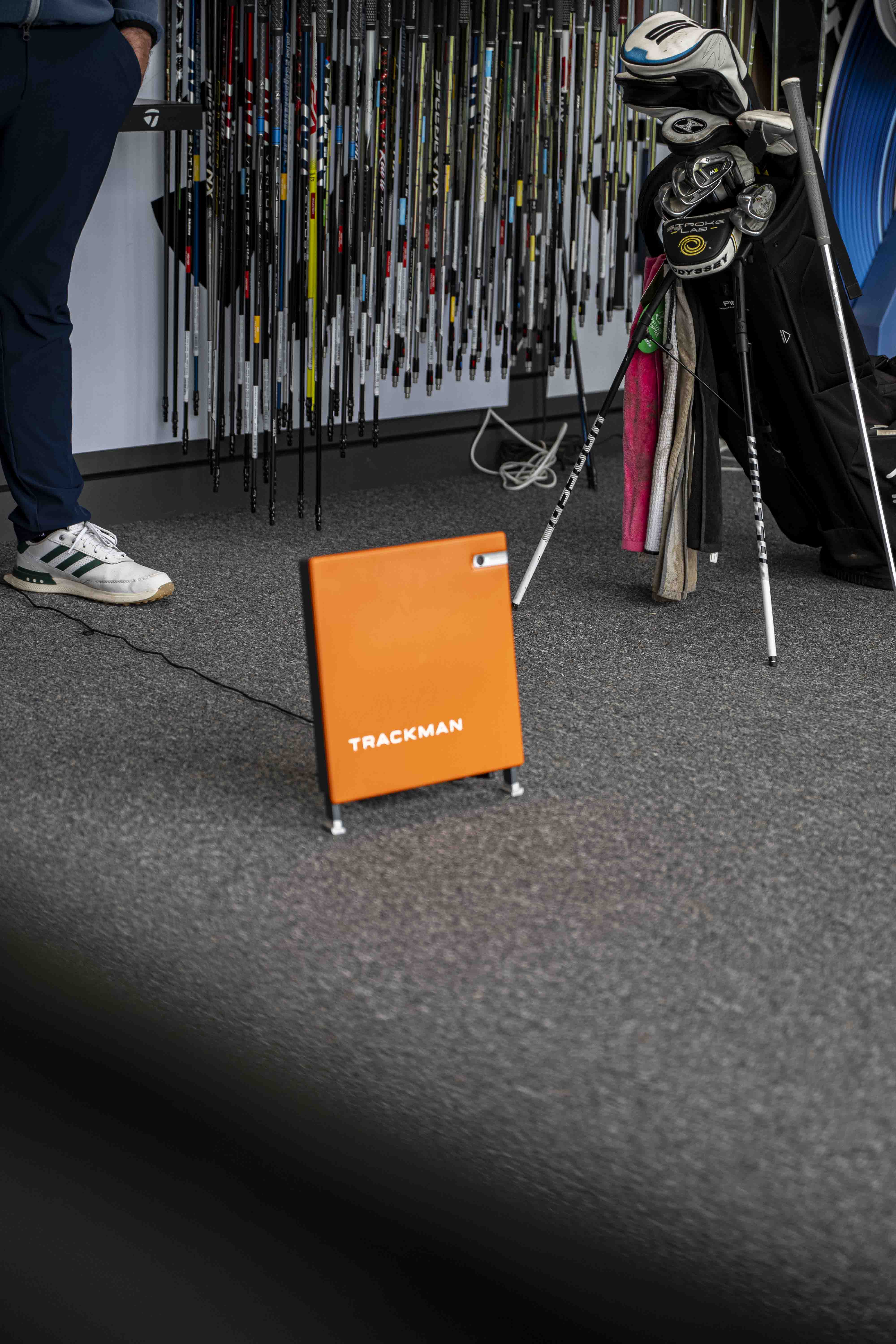 TrackMan bay interior with screen showing ball flight data