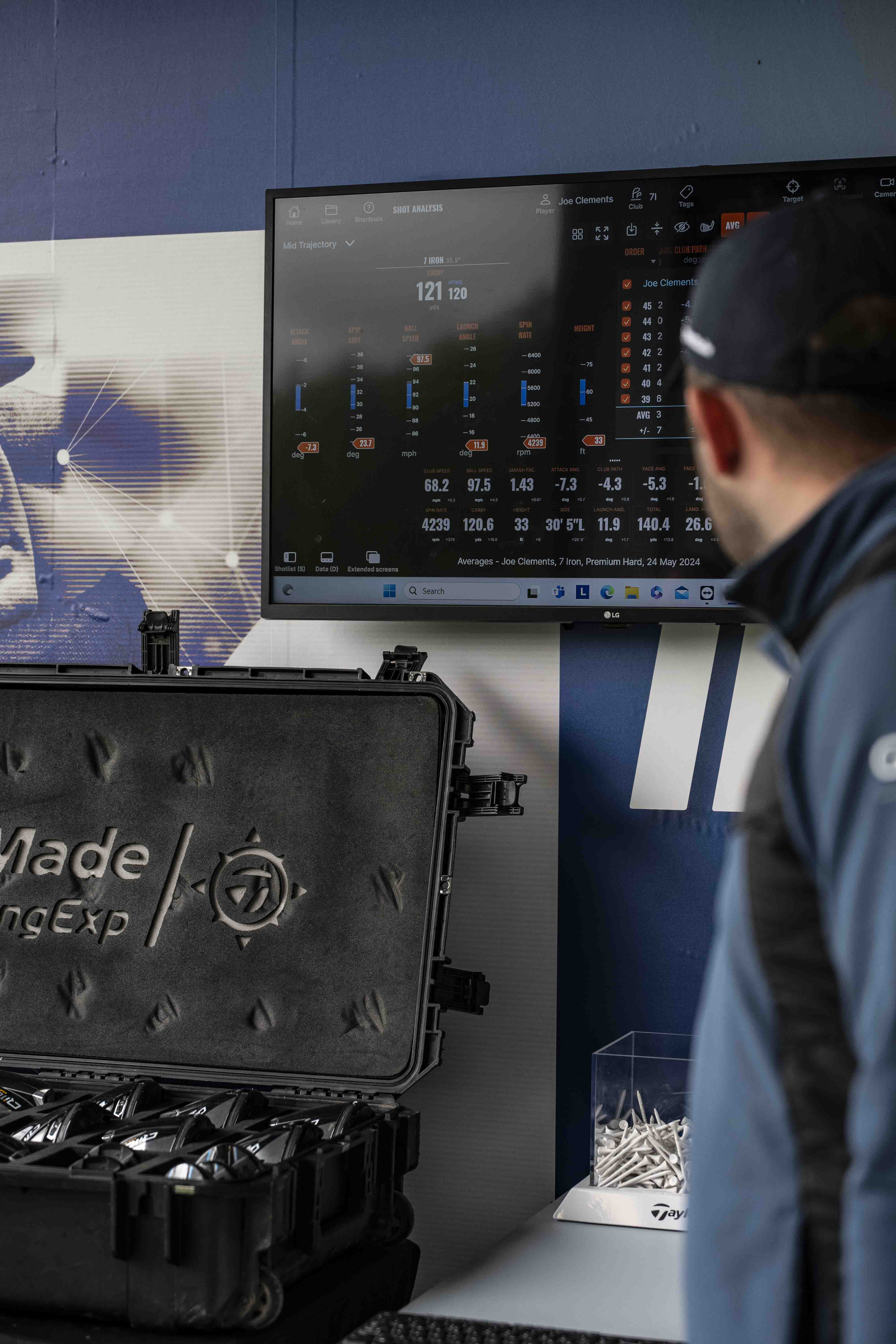 TrackMan bay interior with screen showing ball flight data