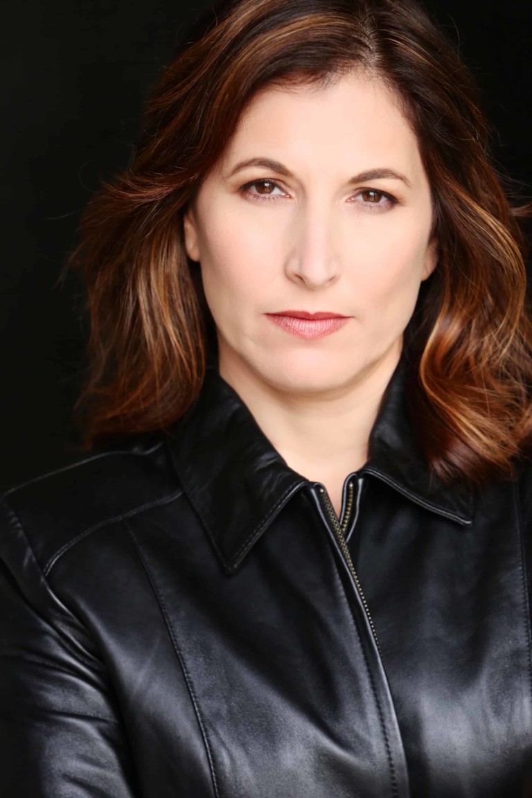 Image of Beth wearing a black leather jacket