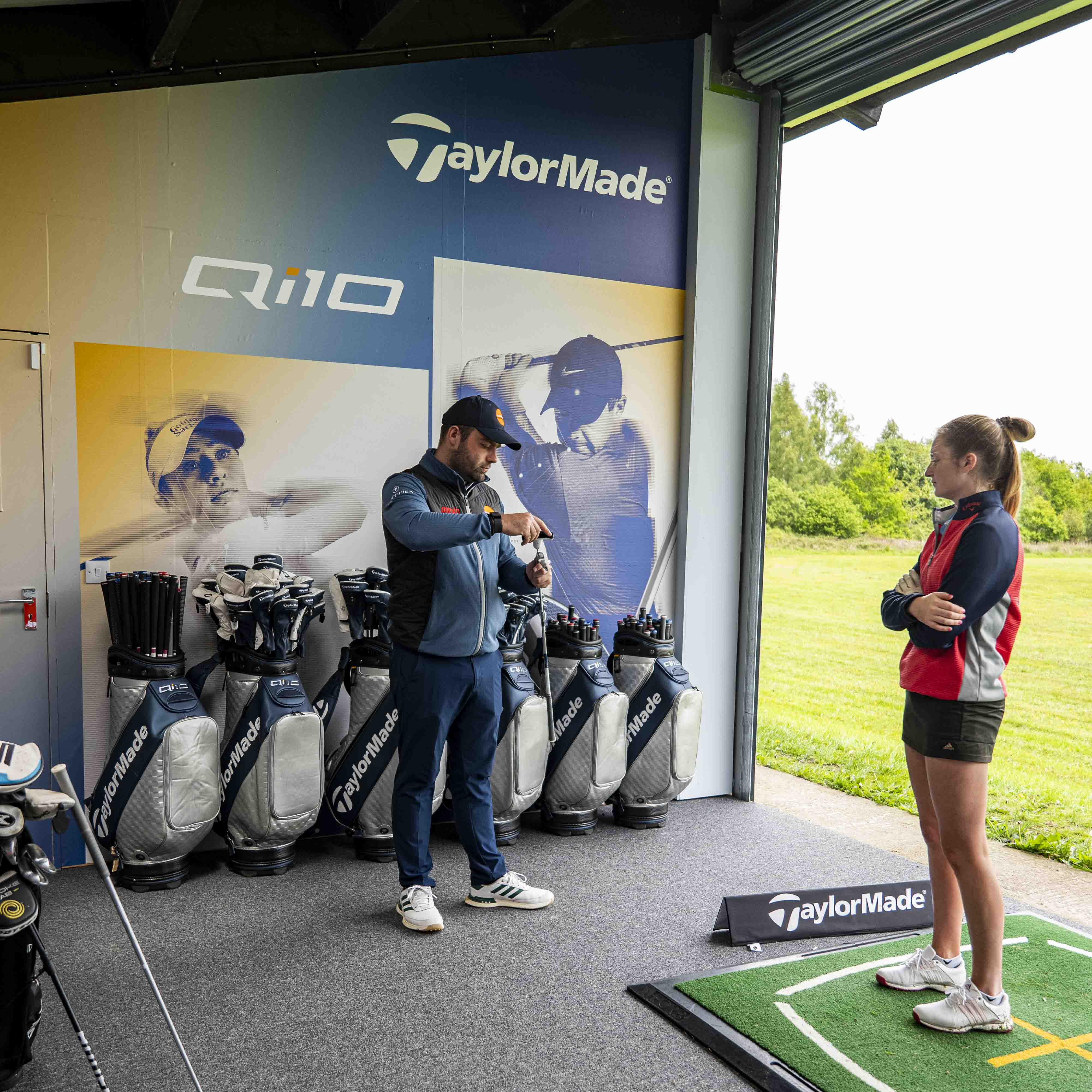 TrackMan bay interior with screen showing ball flight data