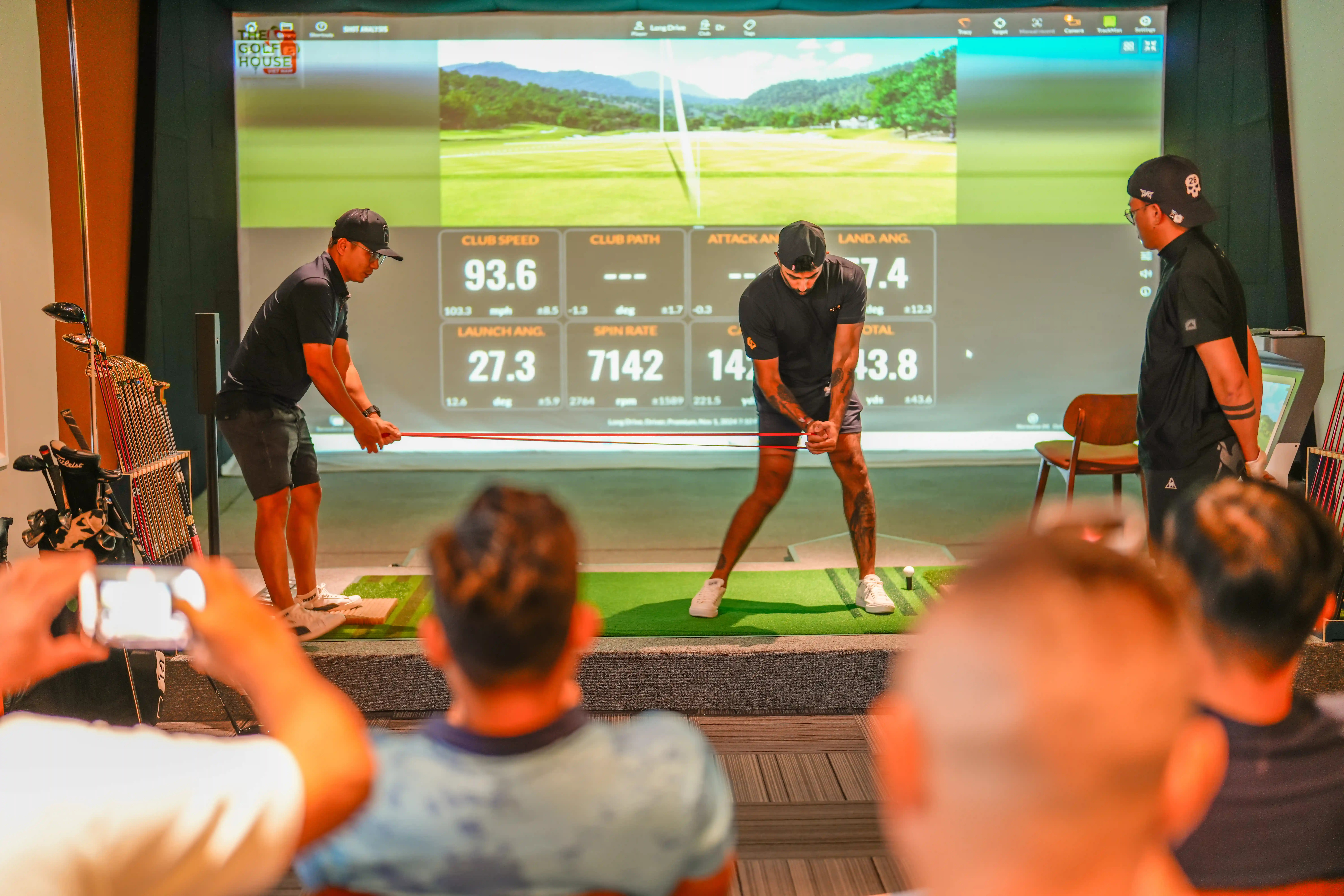 A man working on his fitness on a stationary bike inside the golf academy's gym.