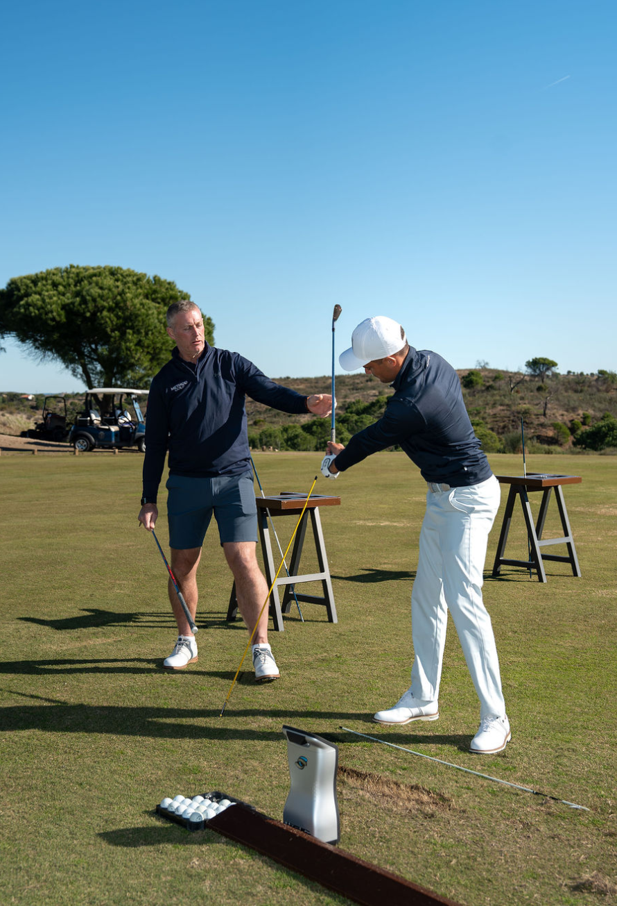 Coach James Peterson teaching swing technique
